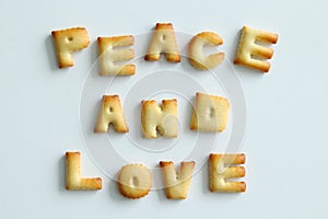 Inscription from the cookies on the white background. Text Ã¢â¬â Peace and love.